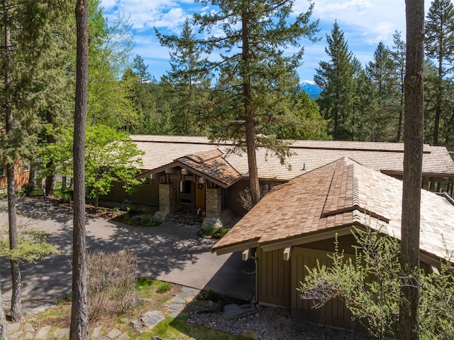 exterior space with stone siding and board and batten siding