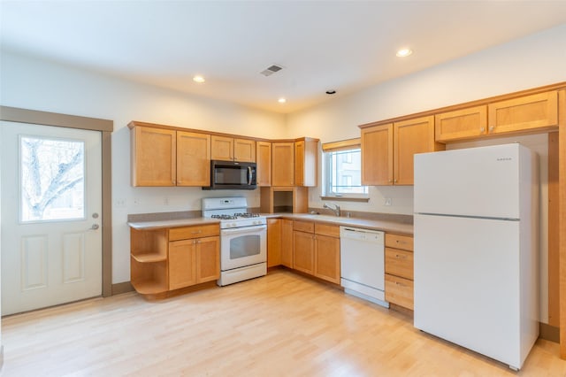 119 Oak St, Whitefish, MT 59937 - kitchen with white appliances, light wood-style flooring, light countertops, and recessed lighting