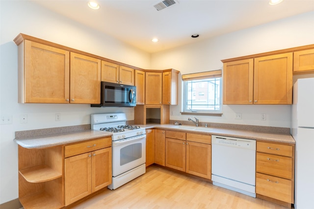 119 Oak St, Whitefish, MT 59937 - kitchen with white appliances, light wood finished floors, light countertops, recessed lighting, and open shelves