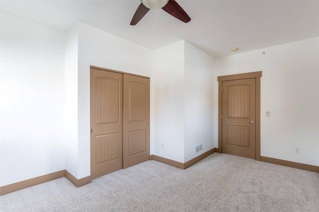 119 Oak St, Whitefish, MT 59937 - unfurnished bedroom featuring carpet floors, a closet, and a ceiling fan