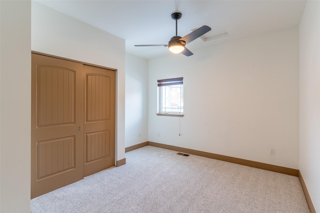 119 Oak St, Whitefish, MT 59937 - unfurnished bedroom featuring carpet flooring, a closet, and a ceiling fan