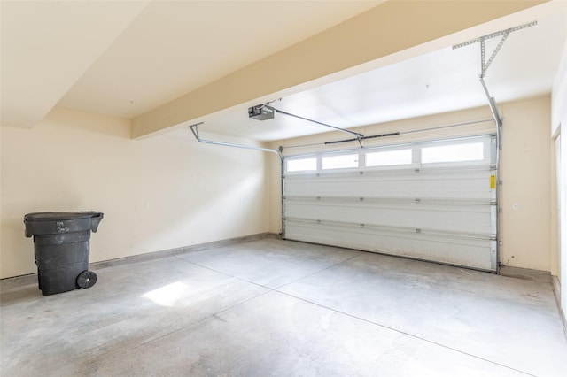 119 Oak St, Whitefish, MT 59937 - garage featuring a garage door opener and baseboards