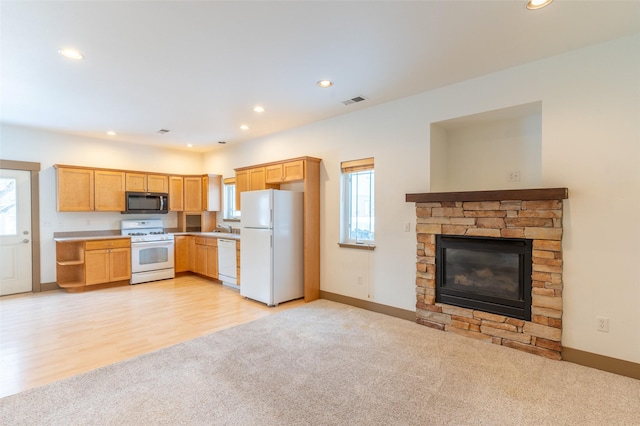 119 Oak St, Whitefish, MT 59937 - kitchen with white appliances, light carpet, healthy amount of natural light, light brown cabinetry, and recessed lighting