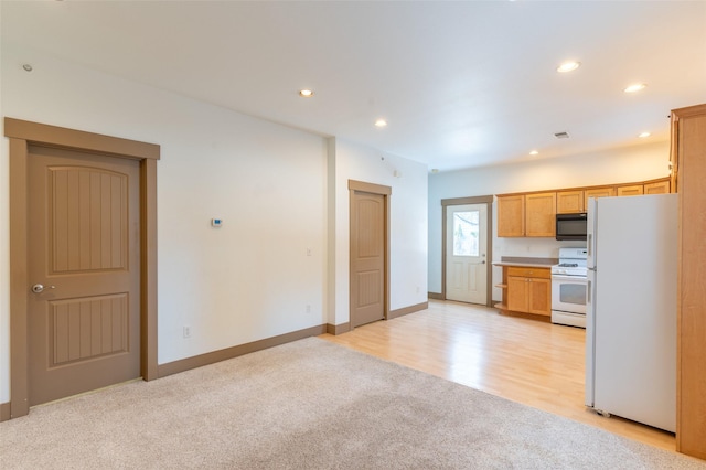 119 Oak St, Whitefish, MT 59937 - kitchen with white appliances, light carpet, recessed lighting, and light countertops