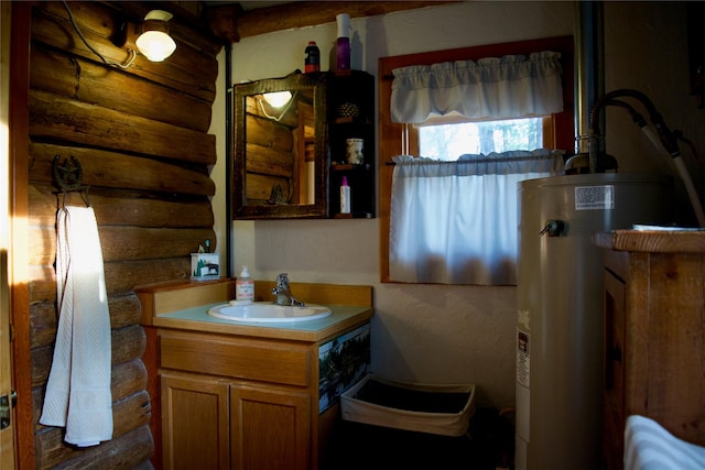 bathroom with log walls, electric water heater, and vanity