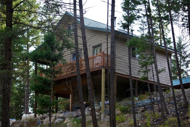 view of property exterior featuring metal roof