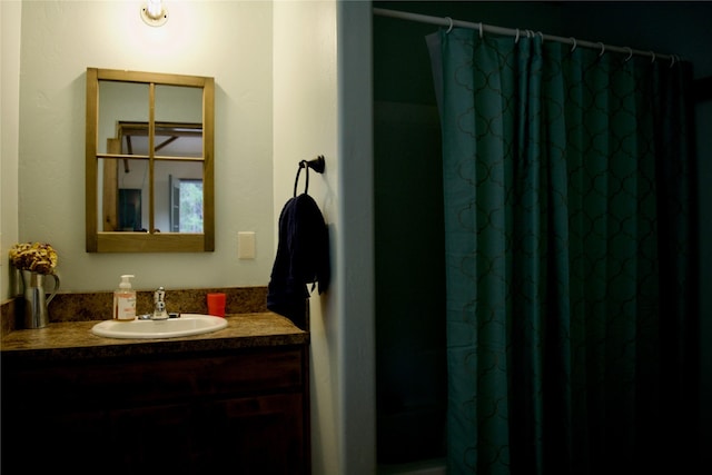 bathroom featuring vanity and a shower with curtain