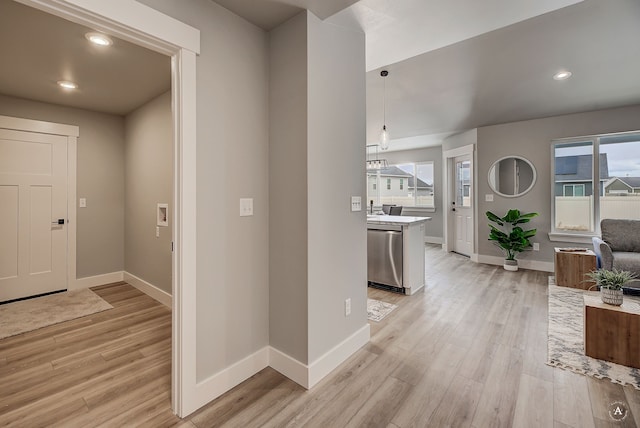 entryway featuring recessed lighting, light wood-type flooring, and baseboards