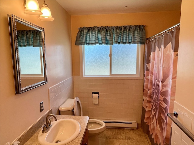 bathroom with tile walls, toilet, a shower with shower curtain, baseboard heating, and vanity