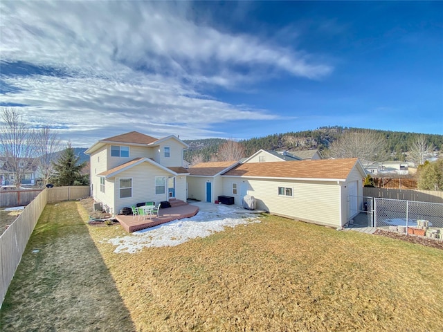 back of house featuring a lawn, a fenced backyard, and a patio area