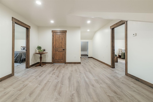 empty room with recessed lighting, light wood-style flooring, and baseboards