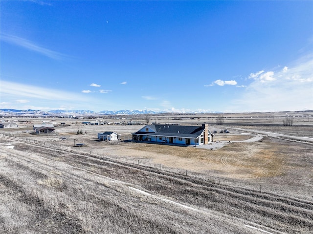 birds eye view of property featuring a rural view and a mountain view