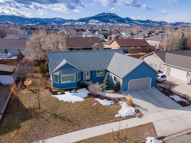 birds eye view of property with a mountain view and a residential view