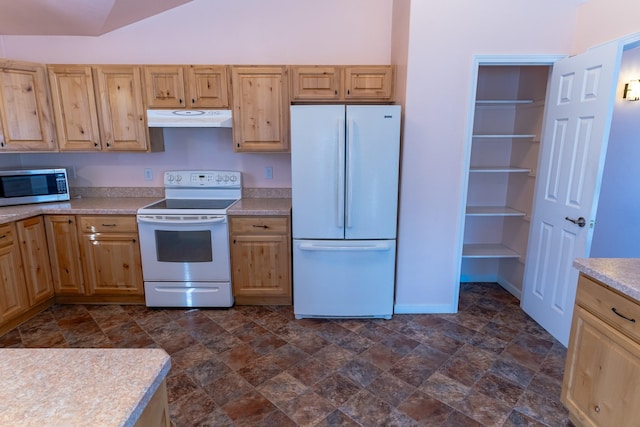 kitchen featuring under cabinet range hood, white appliances, light countertops, and light brown cabinetry