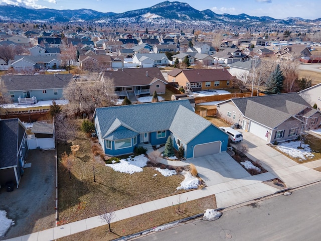 aerial view featuring a mountain view and a residential view