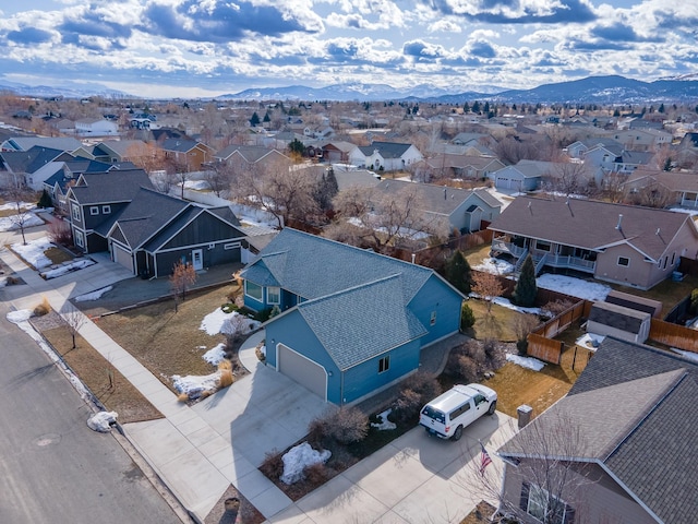 birds eye view of property featuring a mountain view and a residential view