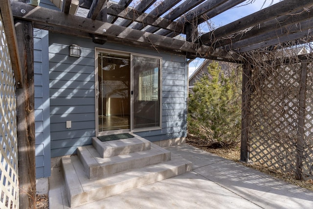 entrance to property featuring a pergola