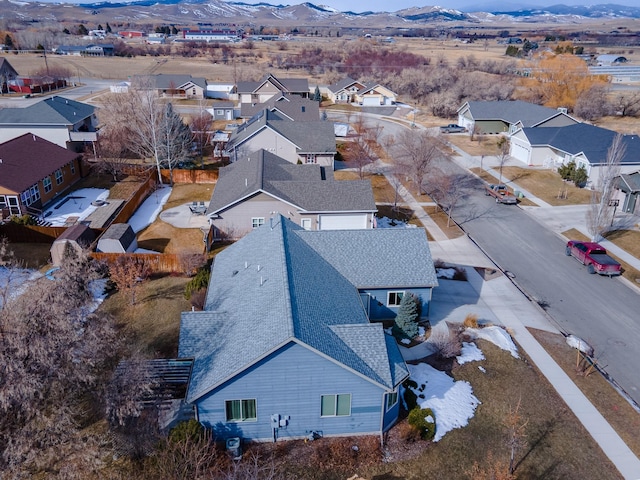 birds eye view of property with a mountain view and a residential view