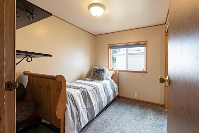 bedroom featuring baseboards, carpet floors, and ornamental molding