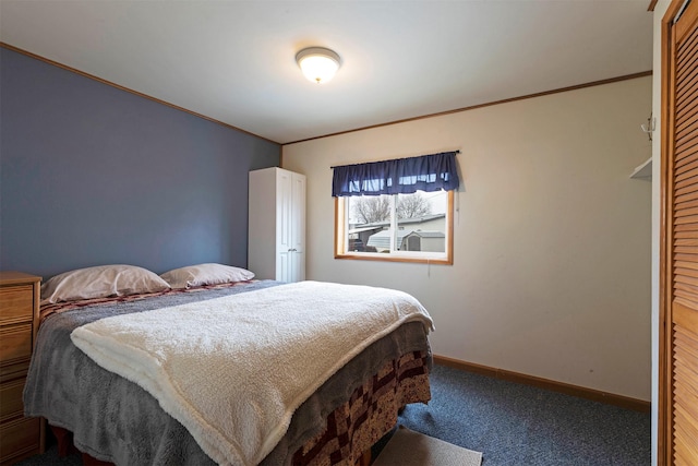 bedroom with carpet flooring, crown molding, and baseboards