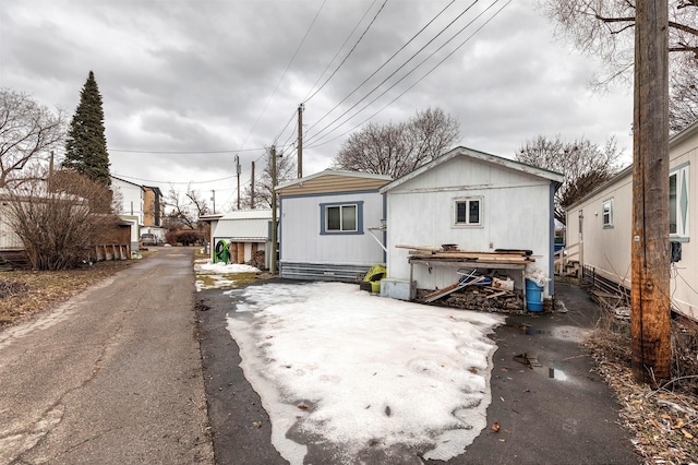 back of property with driveway