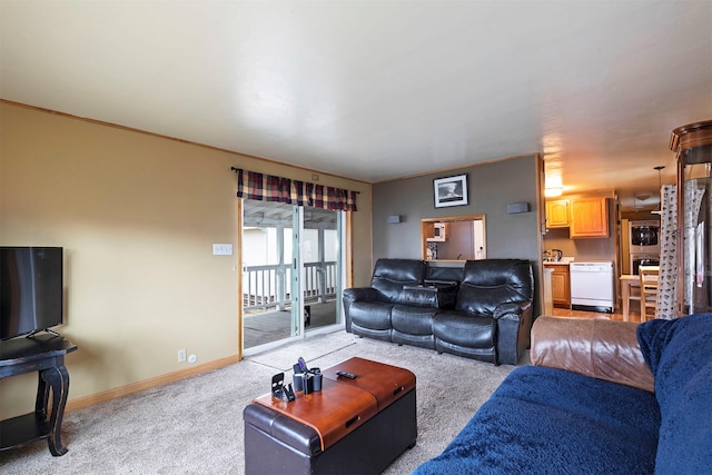 living area with light carpet and baseboards