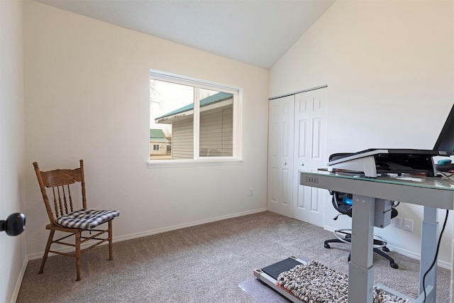 carpeted office with baseboards and vaulted ceiling