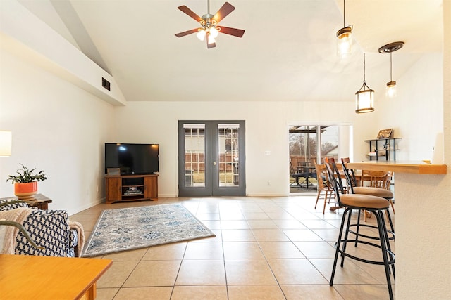 living room featuring light tile patterned floors, french doors, visible vents, and ceiling fan