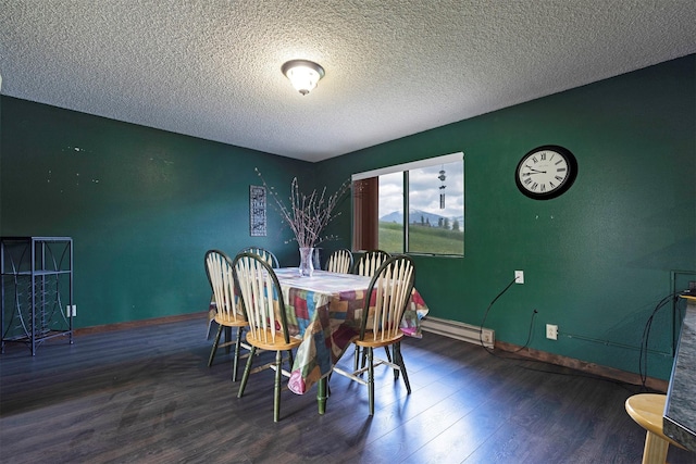 dining room with wood finished floors, baseboards, and a textured ceiling