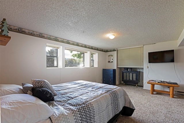 carpeted bedroom featuring a textured ceiling