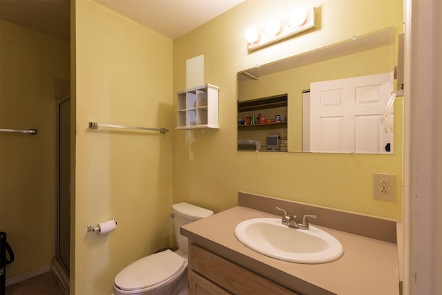 full bath with vanity, toilet, and a shower stall