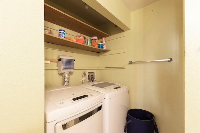 laundry area featuring laundry area and separate washer and dryer