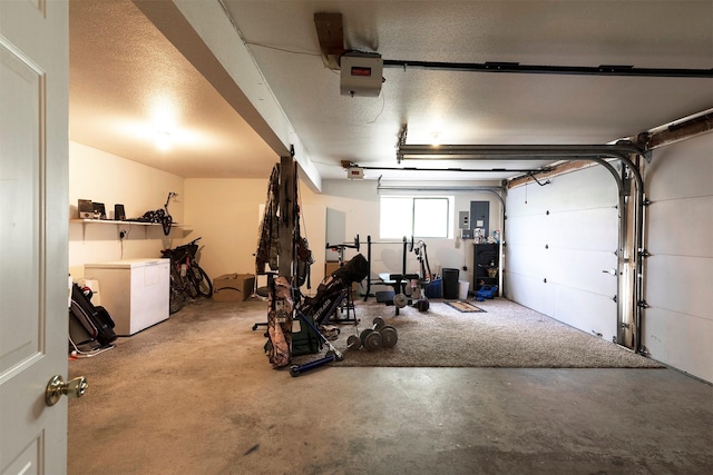 garage featuring electric panel, refrigerator, and a garage door opener