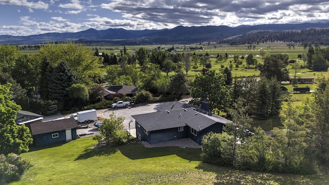 birds eye view of property with a mountain view