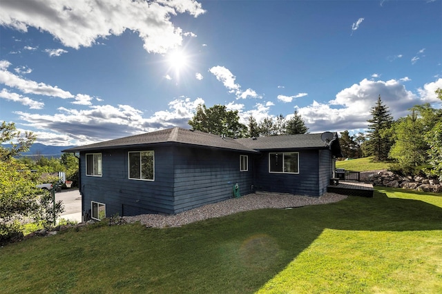 view of side of property featuring a yard