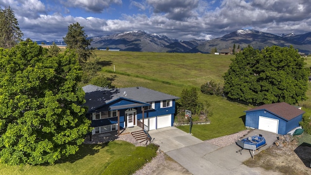 birds eye view of property with a rural view and a mountain view