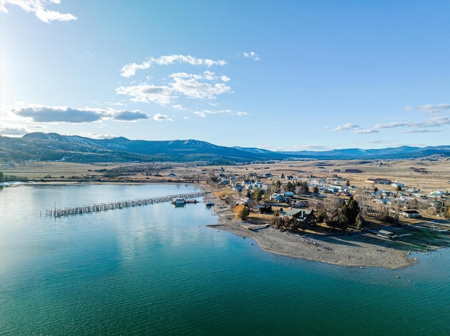 aerial view featuring a water and mountain view