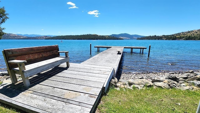 dock area with a water and mountain view