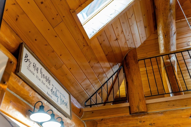 interior details with wooden walls and a skylight