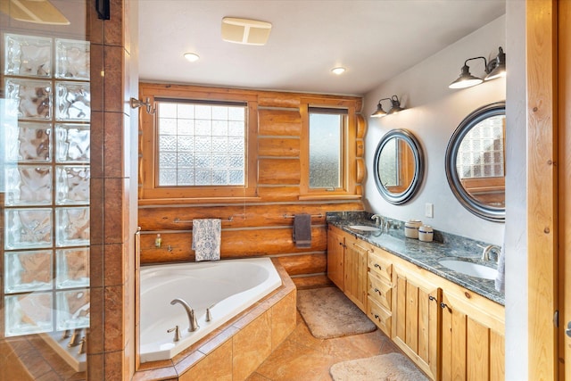 bathroom featuring double vanity, log walls, a garden tub, and a sink