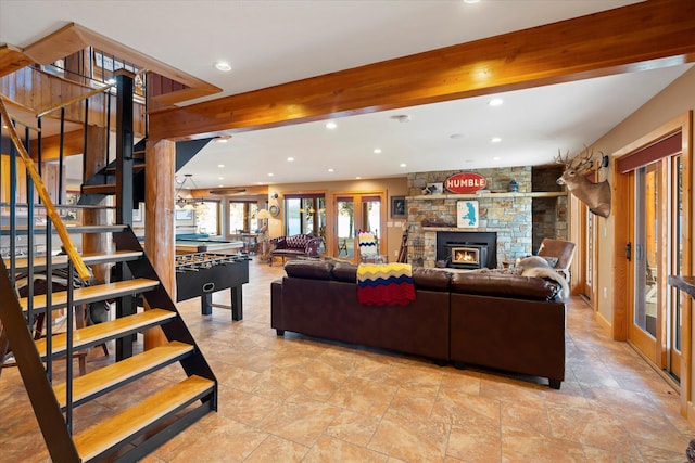 living area with recessed lighting, stairway, beam ceiling, and a fireplace