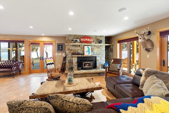 living room featuring plenty of natural light, french doors, and recessed lighting