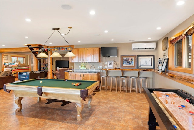 rec room featuring recessed lighting, indoor wet bar, and a wall unit AC