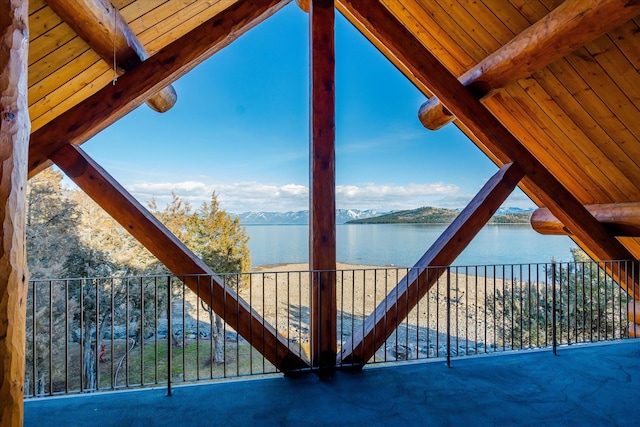 exterior space with a water and mountain view