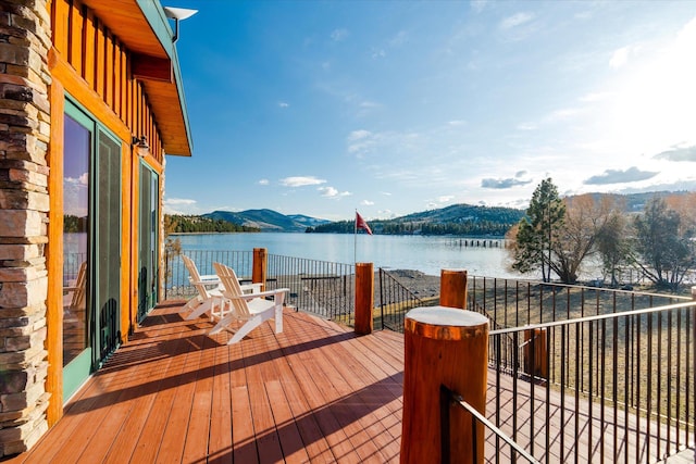 view of dock featuring a water and mountain view