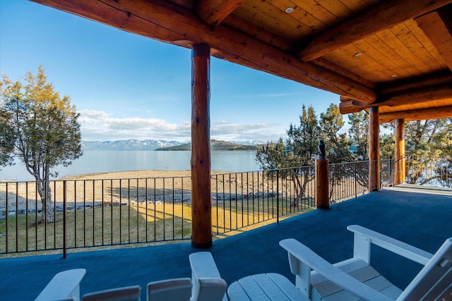 view of patio / terrace featuring a balcony and a water and mountain view