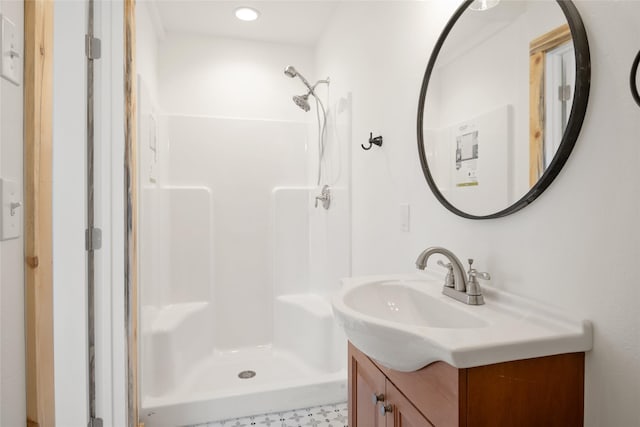 bathroom with vanity and a stall shower