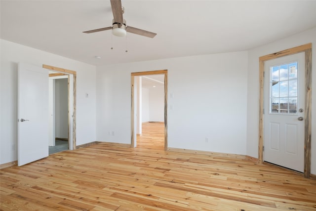 interior space featuring ceiling fan and light wood-style flooring