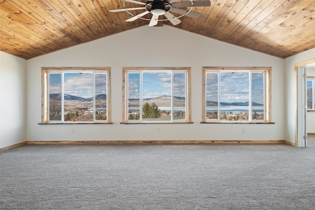 carpeted empty room featuring baseboards, wooden ceiling, a ceiling fan, and lofted ceiling