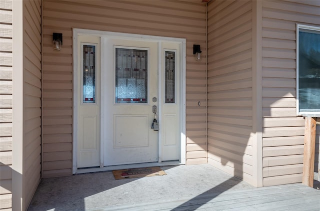 property entrance with brick siding